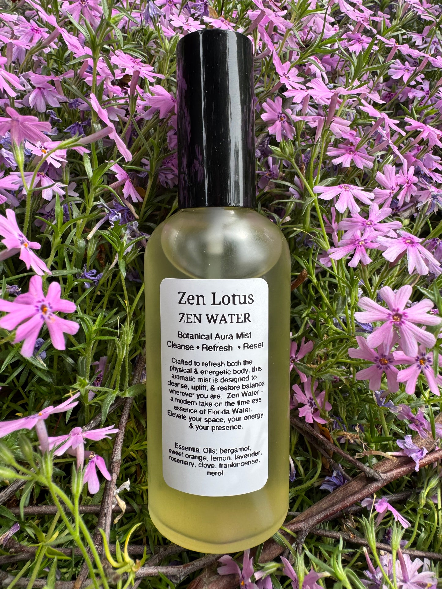 Zen Lotus Zen Water bottle on a bed of pink flowers